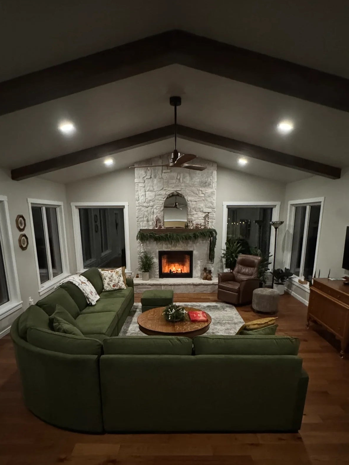 Stone fireplace installed by Backwoods in a vaulted living room